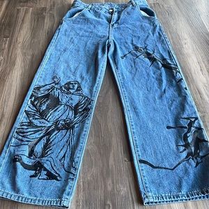 Jeans with graphic, size medium, good condition, barley worn.